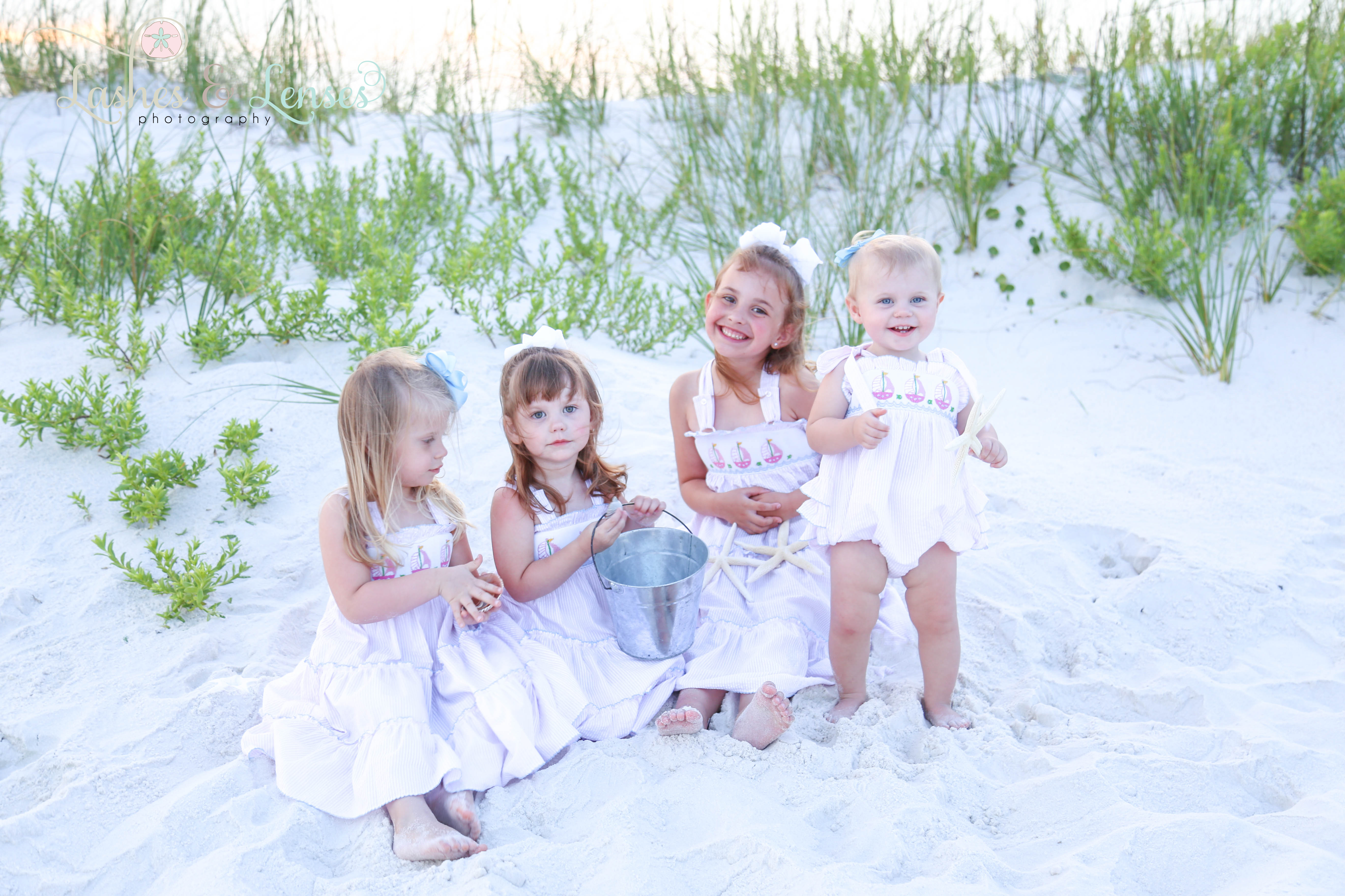 Little children sitting in the sand at Johnsons Beach Perdido Key