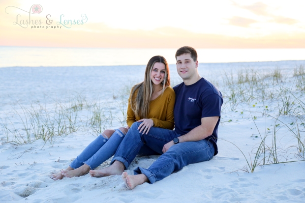 Young couple sitting in the sand at Johnsons Beach in Perdido Key