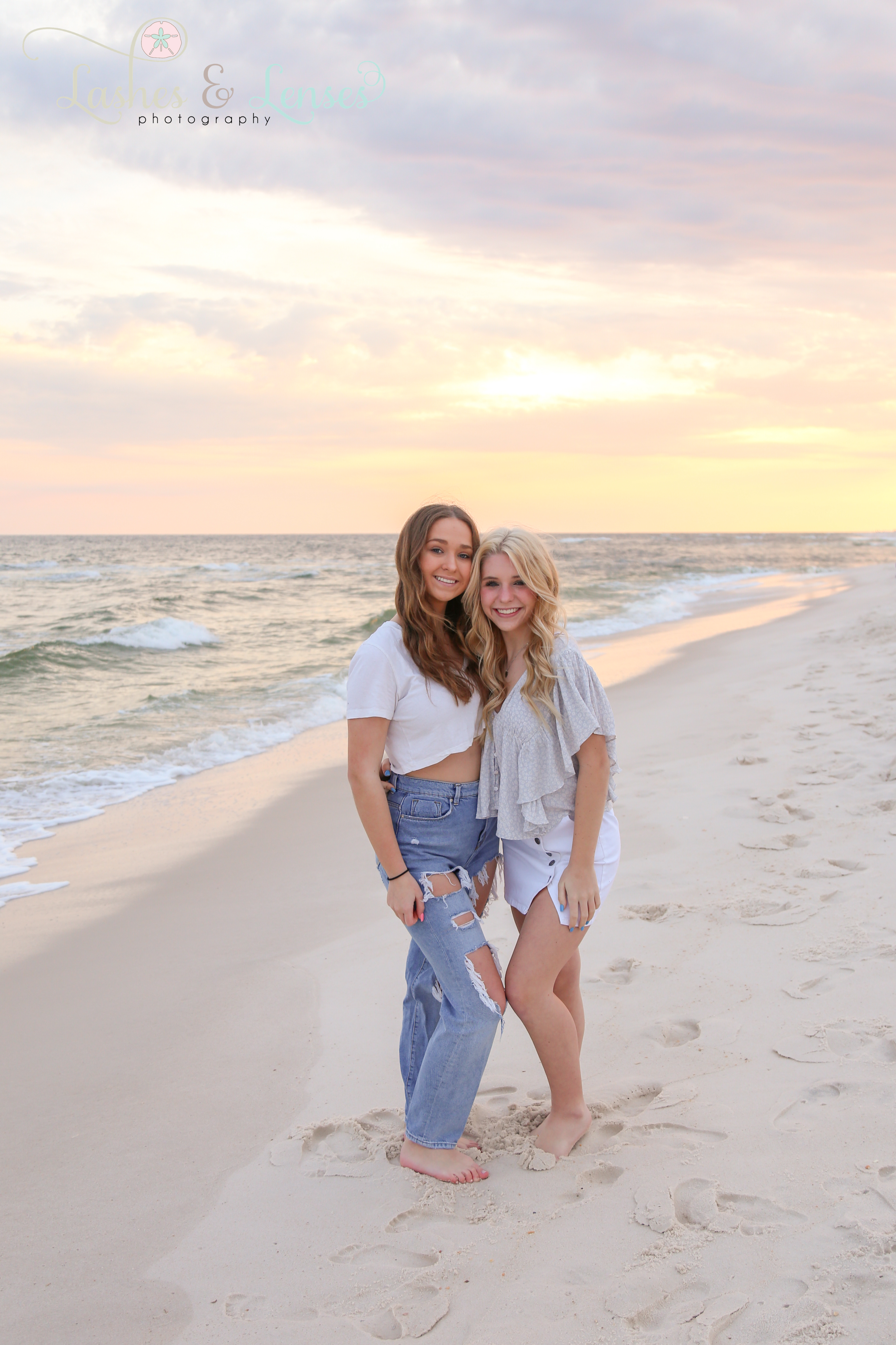 Teen friends by the edge of the water at Johnsons Beach in Perdido Key