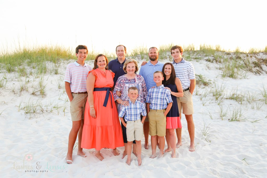 Extended family consisting of grandparents and their two sets of children and grandchildren at Johnsons Beach in Perdido Key Florida